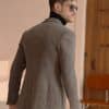 blazer (1) Crafted from 100% pure wool in a tactile tweed texture, this desert brown casual blazer seamlessly marries a refined business-gentleman style with smart-casual practicality. Tailored in a modern slim fit, it features a classic notch lapel (7–9 cm width), a two-button single-breasted front, long sleeves, and a regular length. Complete with functional 3D patch pockets, a subtle curved hem, and double rear vents for optimal ease of movement, this winter-weight jacket is also treated with a non-iron finish for low-maintenance care. Ideal for young men seeking rich warmth and timeless elegance, it brings a sophisticated, versatile edge to winter wardrobes.